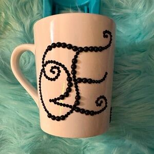 Personalized mug with stones.